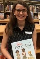 Julie Perrin with the book, She Persisted