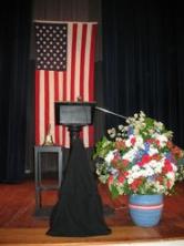 Flag, Podium, and Flowers