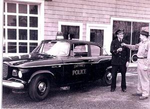 Roland W. Desrosiers presenting Chief Lucien Vigneault with the keys to the new cruiser, 1960