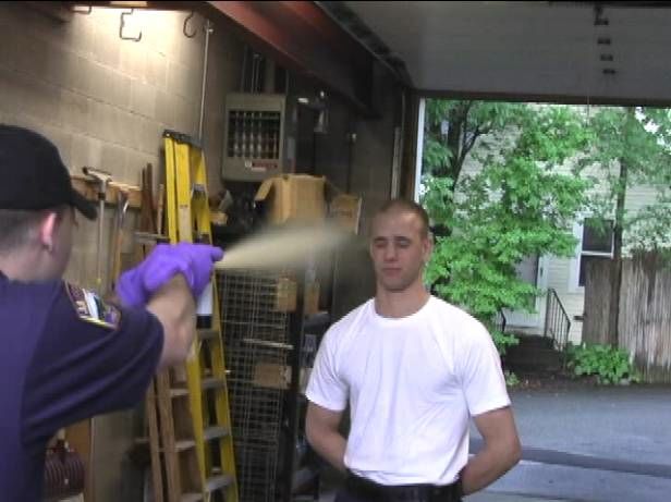 man being sprayed with hose