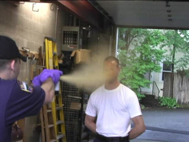  man being sprayed with hose