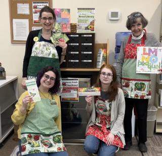 Library staff in their new gardening aprons